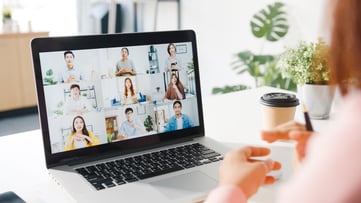 young-asia-businesswoman-using-laptop-talk-colleague-about-plan-video-call-meeting-while-work-from-home-living-room